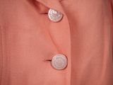 an image of a close up of a jacket with buttons