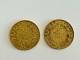 two gold coins, one of which has a crown and the other of which has a crown on it