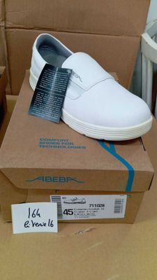 a box with a pair of white shoes on top of it