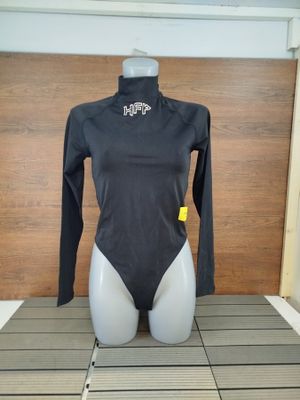 a mannequin with a black bodysuit on a table