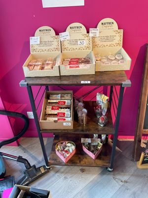 many boxes of food on a table in a room