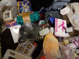 a pile of clothing and other items on the floor