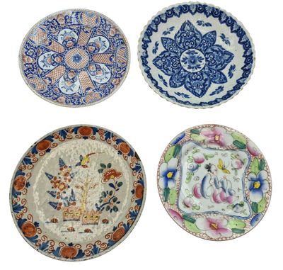 four plates with different designs and designs on them on a white background