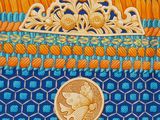 an image of a close up of a gold coin on a blue and orange background