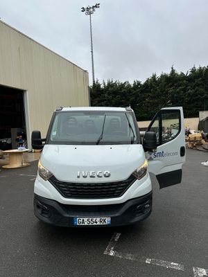 a white van that is parked in a parking lot