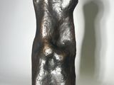 sculpture of a man ' s torso on a marble base