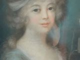 portrait of a young woman in a blue dress with a feathered hat