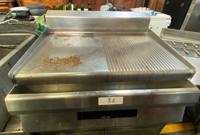an image of a commercial gas grill in a kitchen