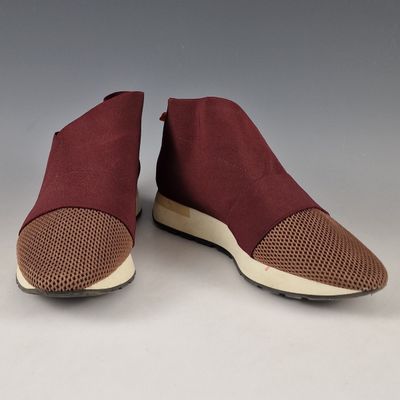a pair of maroon slip on shoes with mesh detailing