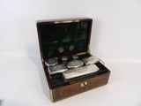 a small wooden box that has a pair of scissors in it
