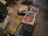 a pile of boxes sitting on the floor in a room