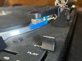 a close up of a turntable with a needle on it
