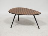 an oval coffee table with a wooden top and black legs
