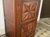 a wooden cabinet that is sitting on the floor