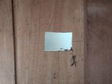 a piece of paper stuck to the wall of a room