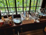 a table with a lot of food on it near a window
