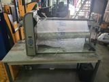 a machine that is sitting on a table in a warehouse