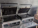 two grills that are sitting on top of each other