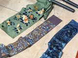 many different types of ties laid out on the floor