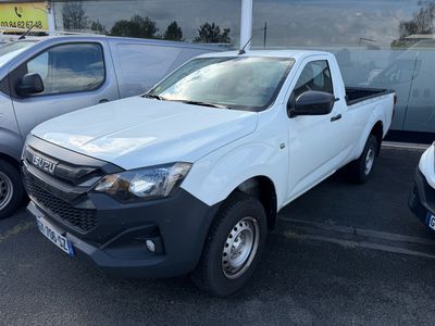 a picture of a white pick up truck parked in a parking lot