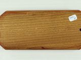 a small piece of wood with a tag on it