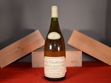 a bottle of wine that is sitting on a table