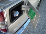 a gas pump in the back of a silver truck
