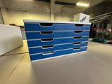 a close up of a blue drawer with five drawers on it