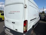 a white van that is parked in a parking lot