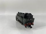 a toy train that is sitting on a white surface