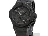 the watch is black and has pink accents on the strap