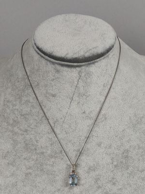 a close up of a necklace on a mannequin mannequin