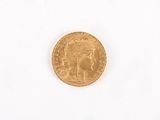 a gold coin with a picture of a woman on it