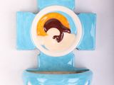 a blue toilet bowl with a picture of a penguin on it