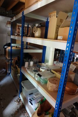 a room with a lot of shelves that have items on them