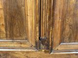 a large wooden cabinet with two doors on it