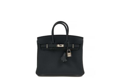 a black leather handbag on a white background