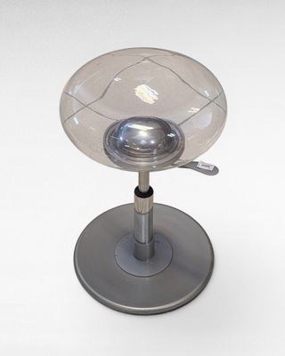 an image of a glass table lamp on a metal base
