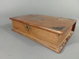 an old wooden box sitting on top of a table
