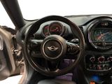 the interior of a small car with a steering wheel and dashboard
