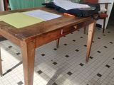 a wooden table with a piece of paper on top of it