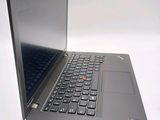 a laptop that is open on a white surface