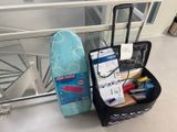 a suitcase and a surfboard sitting on the floor