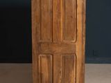 an old wooden door with four panels on the top and bottom of it