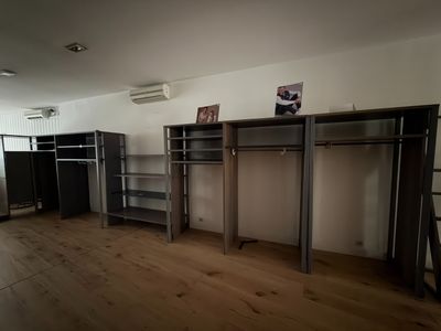 a room with a lot of closets and shelves in it