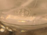 a close up of a glass vase with a logo on it
