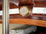 a clock that is on the side of a boat