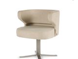 an image of a chair with a metal base and a beige upholstered seat