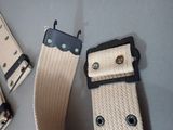 two belts that are sitting on a table