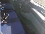 a picture of a car with blue seats and a steering wheel